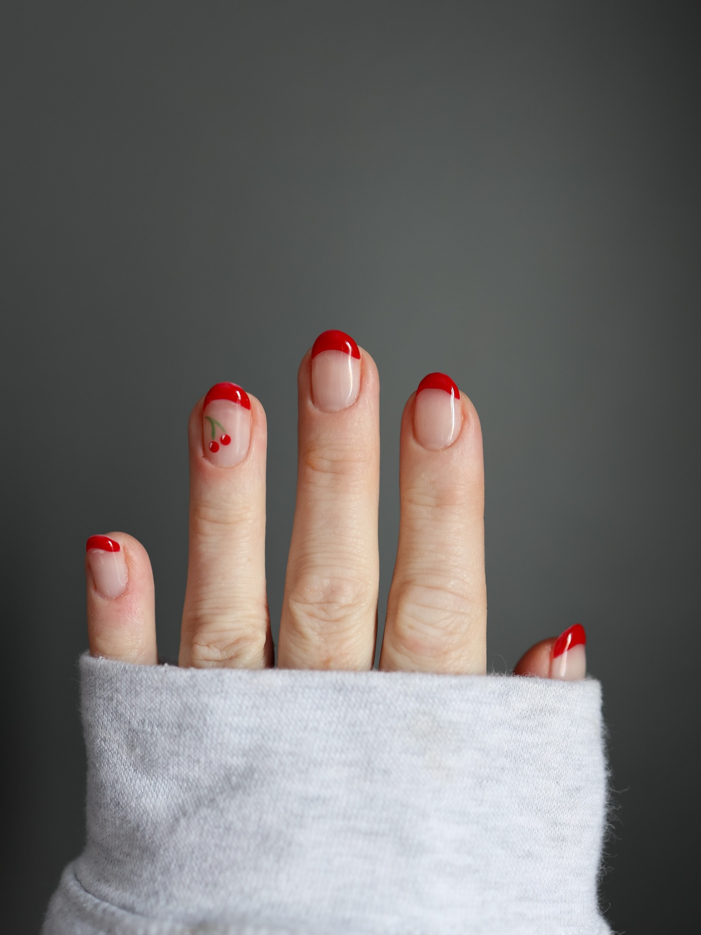 Cherry-design French tip nail art